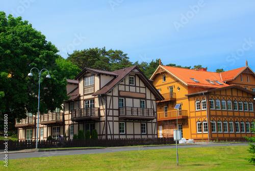Traditional Lithuanian wooden and half-timber houses in the countryside.