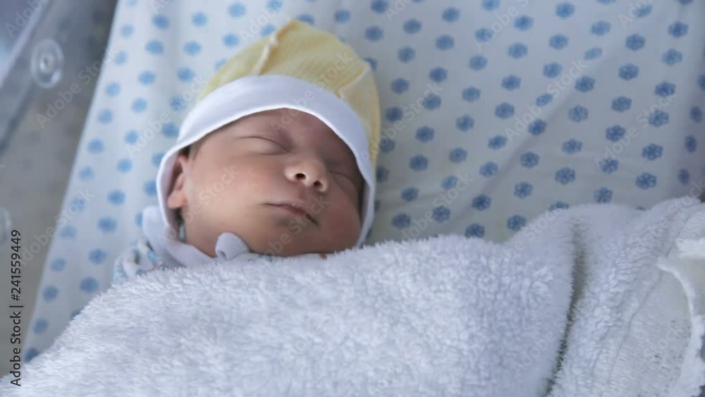 New born baby girl is sleeping in maternity hospital New born baby girl is sleeping in maternity hospital