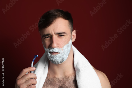 Displeased man with shaving...