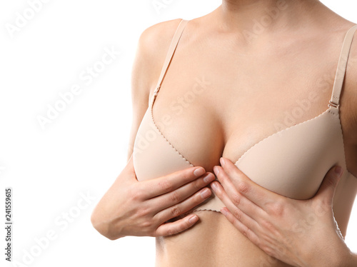 Young woman with beautiful breast on white background
