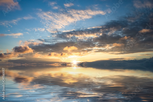 Fototapeta Naklejka Na Ścianę i Meble -  Magnificent bright sunset over the calm surface of the sea.