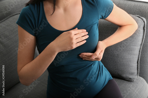 Εκτύπωση καμβά Pregnant woman touching her breast at home