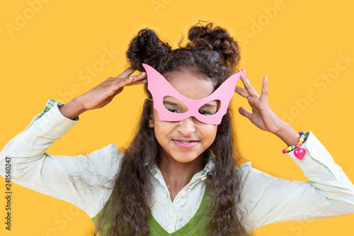 Cheerful nice girl wearing a masquerade mask