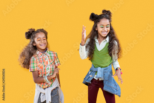 Positive afro american girls dancing to music