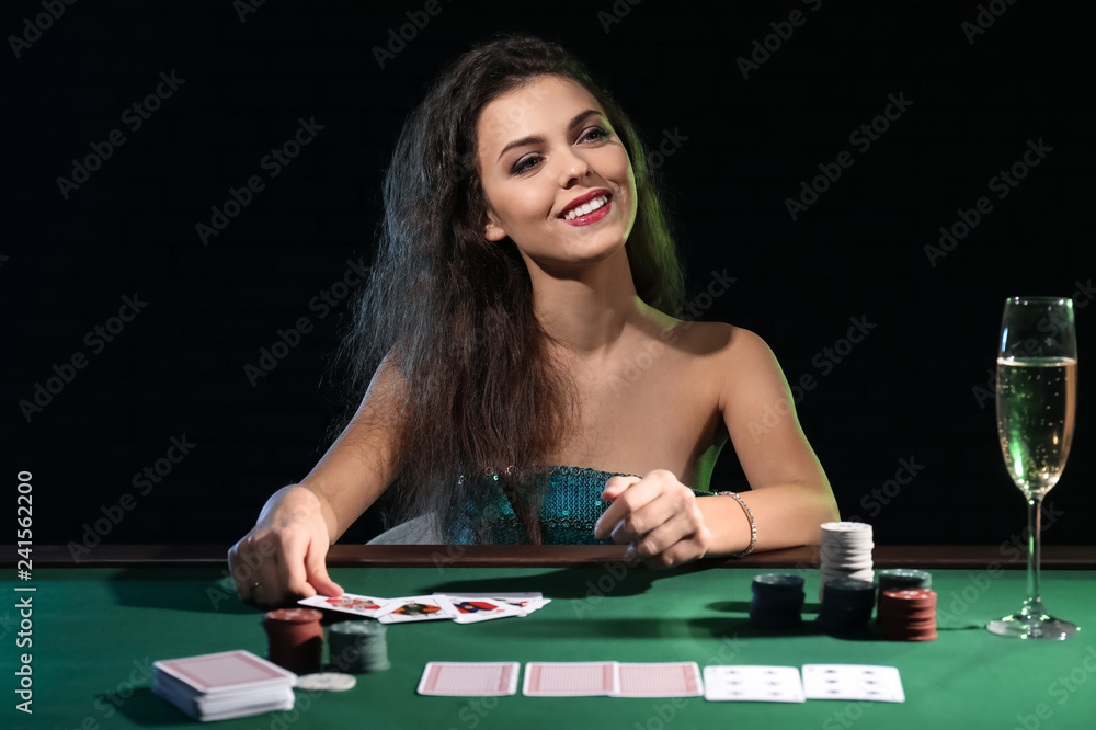 Beautiful female player at table in casino Beautiful female player at table in casino