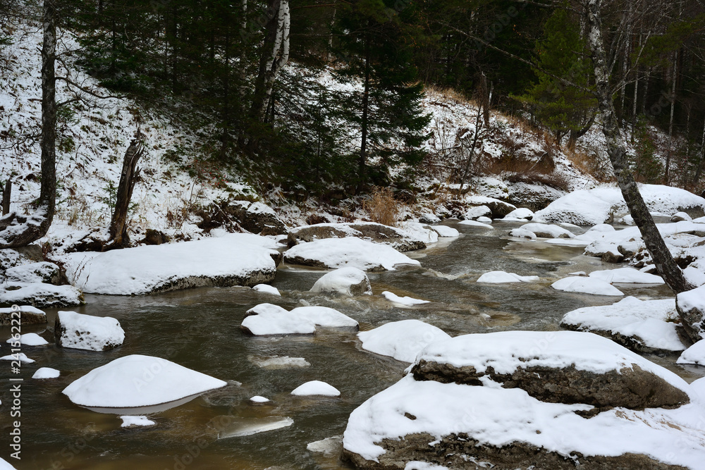 rocky mountain river in the resort of Belokurikha in winter rocky mountain river in the resort of Belokurikha in winter