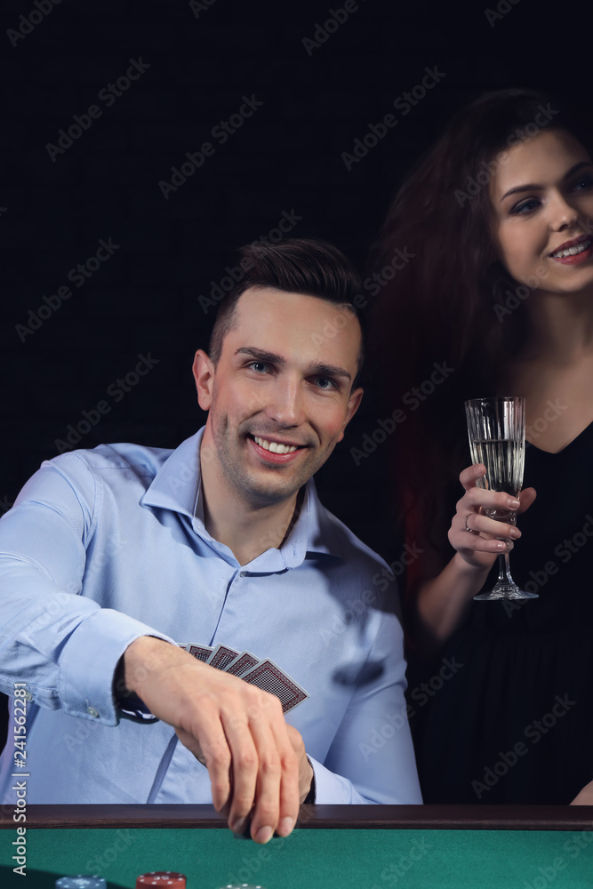 Man with his lady playing in casino