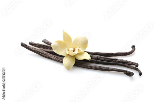 Aromatic vanilla sticks on white background photo