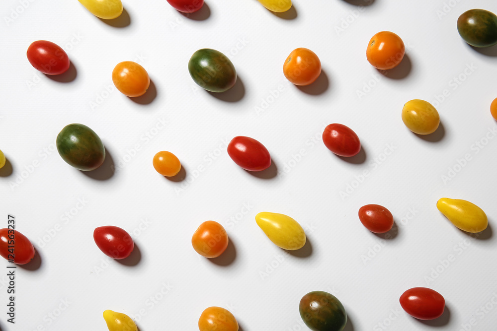 Many colorful tomatoes on white background Many colorful tomatoes on white background