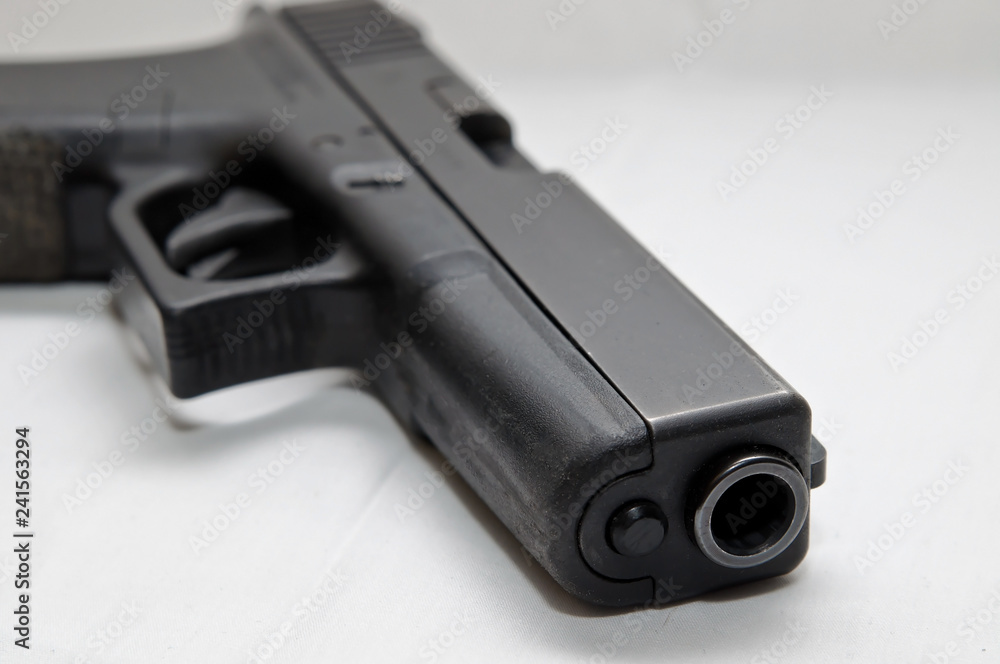 A black semi automatic 40 caliber pistol on a white background A black semi automatic 40 caliber pistol on a white background