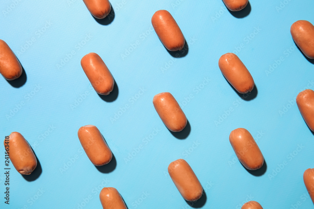 Many tasty sausages on color background Many tasty sausages on color background