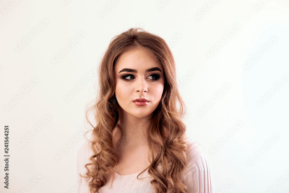Beautiful girl with long wavy hair . Brunette with curly hairsty Beautiful girl with long wavy hair . Brunette with curly hairsty