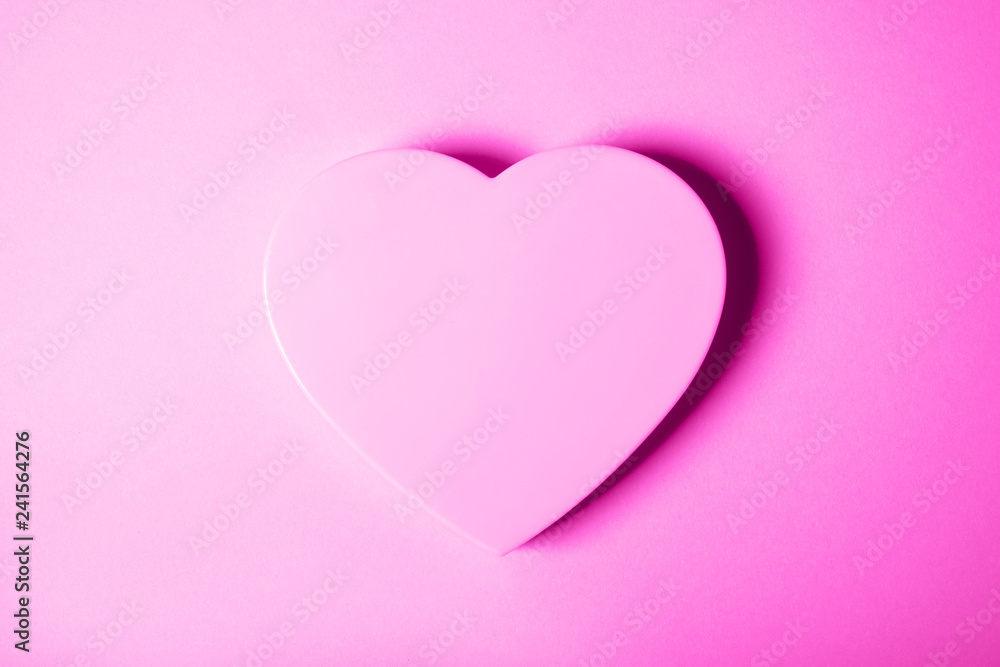 Pink heart on gradient background.
