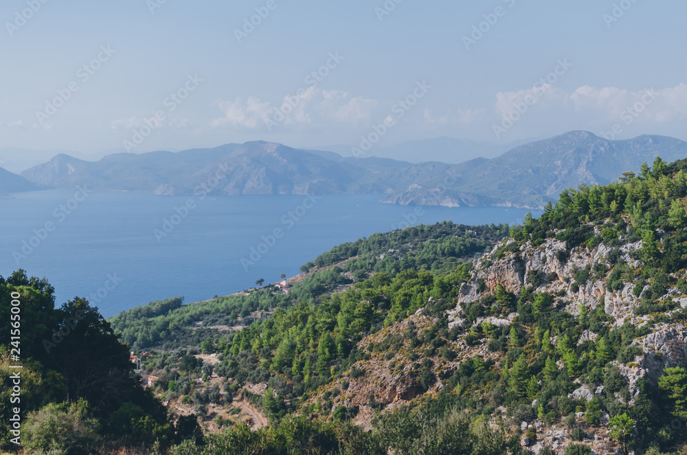 Beautiful landscape with calm water and mountains on shore at sunny day, Kas, Antalya, turkey