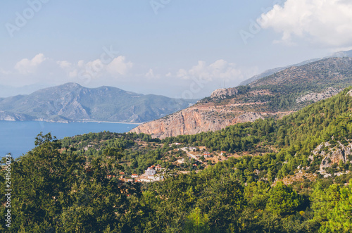 Beautiful landscape with calm water and mountains on shore at sunny day, Kas, Antalya, turkey