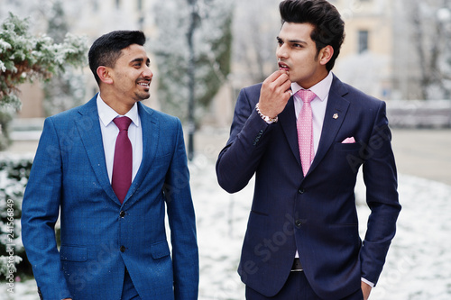 Two elegant indian fashionable mans model on suit posed at winter day.