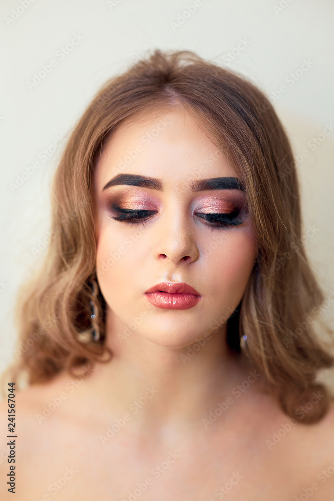 Beautiful model girl with Fashion Luxury Makeup, long eyelashes, perfect skin facial make-up. Beauty Brunette model woman holiday make up close up. Eyelash extensions, false eyelashes. Beauty Woman. Beautiful model girl with Fashion Luxury Makeup, long eyelashes, perfect skin facial make-up. Beauty Brunette model woman holiday make up close up. Eyelash extensions, false eyelashes. Beauty Woman.