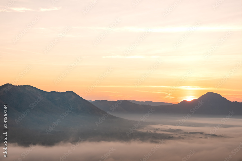 Morning atmosphere at Mueang Loei Chiangkhan with warm tone and mountain range covered with fog
