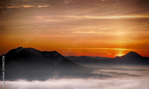 Morning atmosphere at Mueang Loei Chiangkhan with warm tone and mountain range covered with fog
