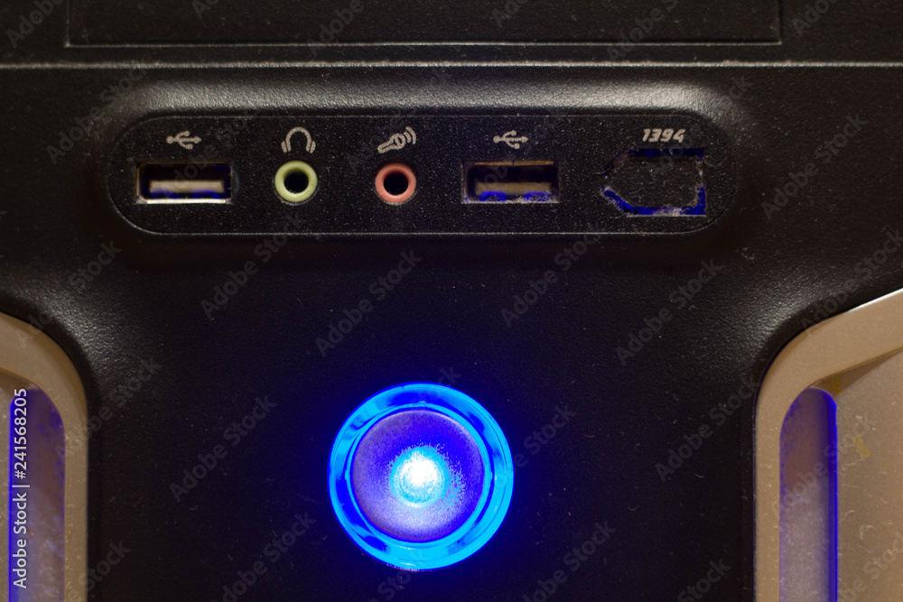 Fototapeta premium The front of the computer with the power button