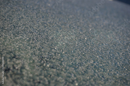 beautiful frosty patterns on the glass of the car