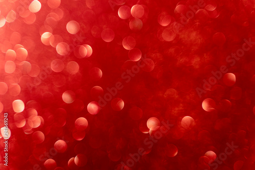 Red background with unfocused glitters, bokeh, for valentines day, mother's day, father's day, christmas, holidays.