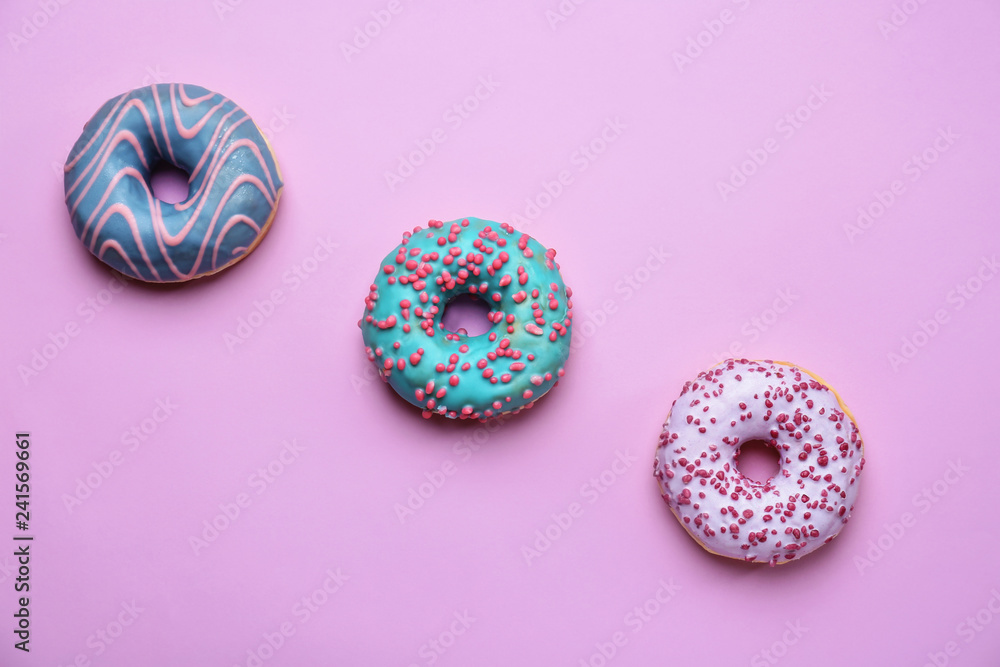 Sweet tasty donuts on color background Sweet tasty donuts on color background
