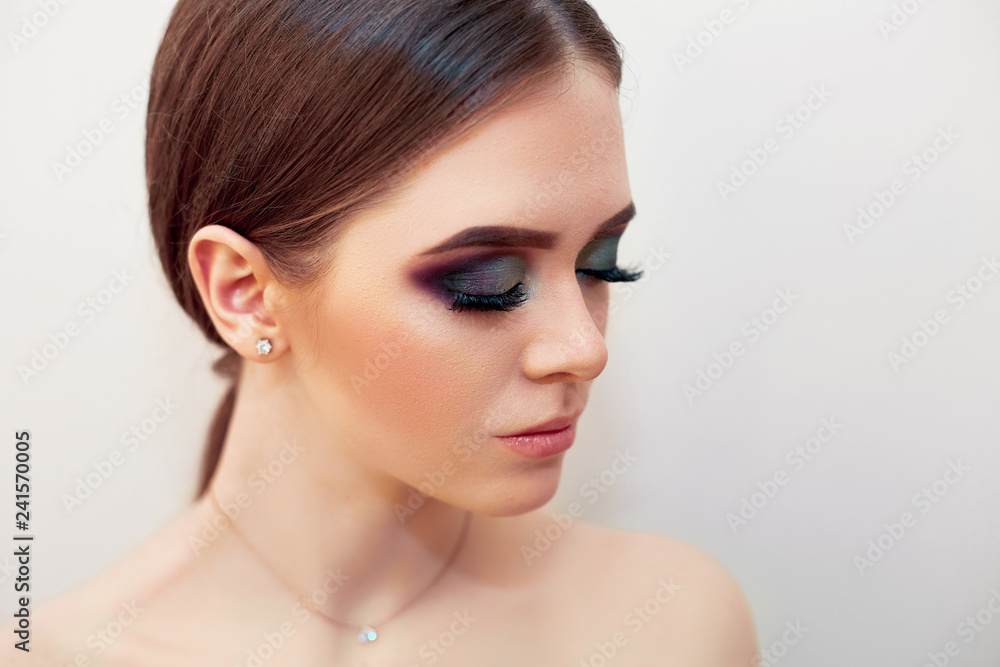 Beautiful model girl with Fashion Luxury Makeup, long eyelashes, perfect skin facial make-up. Beauty Brunette model woman holiday make up close up. Eyelash extensions, false eyelashes. Beauty Woman Beautiful model girl with Fashion Luxury Makeup, long eyelashes, perfect skin facial make-up. Beauty Brunette model woman holiday make up close up. Eyelash extensions, false eyelashes. Beauty Woman