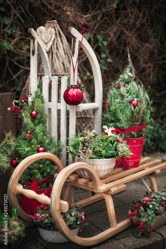 Christmas decorations on the street with old wooden sled. Christmas festive background