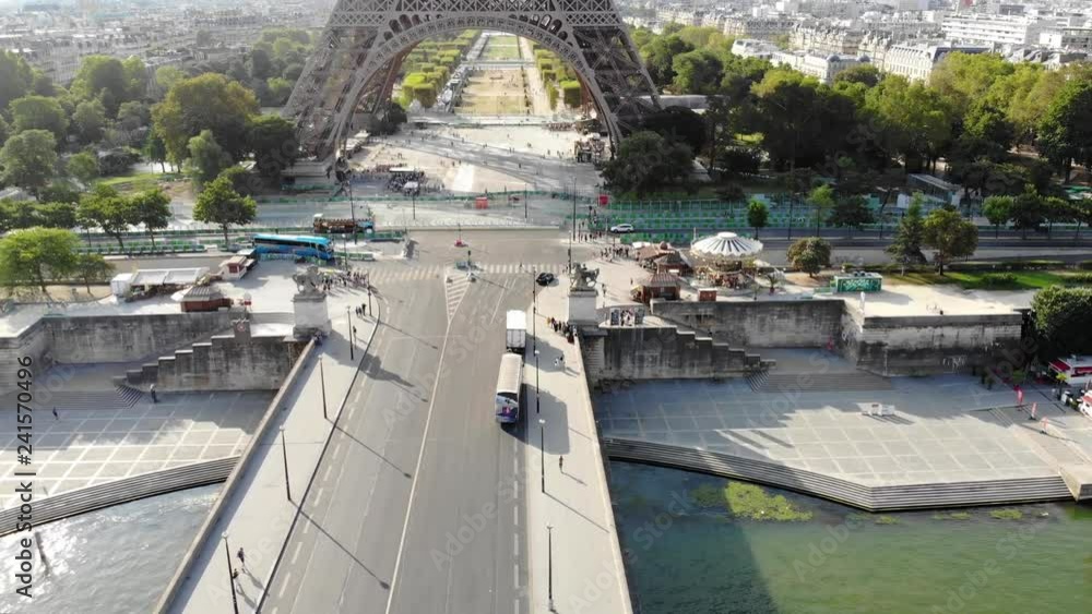 Aerial view of the Eiffel Tower with bridge in front, over the river in Paris, 4K Aerial view of the Eiffel Tower with bridge in front, over the river in Paris, 4K