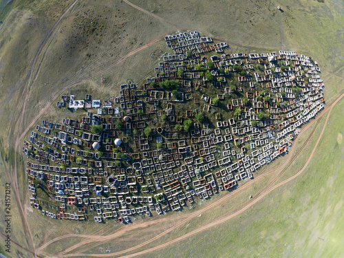 Traditional Kazakh cemetery in the steppe landscape of stone mountains 