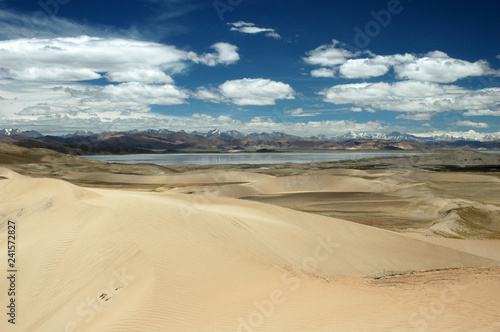 Sandy hills and blue sky in Tibetan landscape