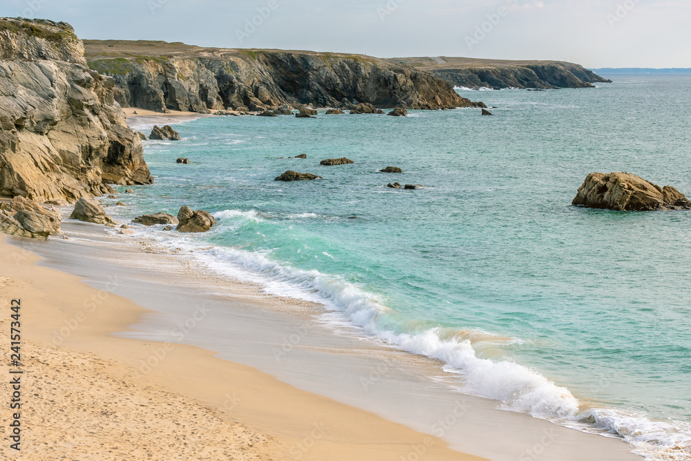 French landscape - Bretagne. A beautiful beach with wild cliffs in the background.