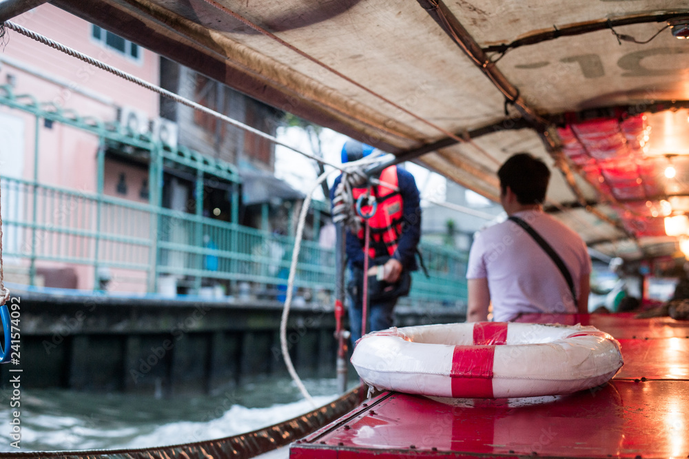 Red and white lifebuoy on the boat in Khlong Saen Saep, canal, Bangkok,Thailand