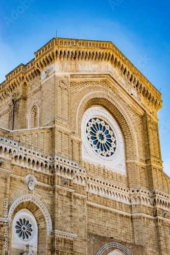 Cathedral of San Pietro Apostolo, also known as Duomo Tonti, by Paolo Tonti, who donated his wealth for its construction. Facade with rose windows. Cerignola, Puglia, Italy. photo