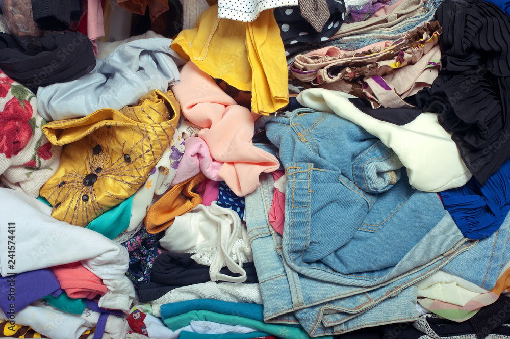 Pile of messy clothes in closet. Untidy cluttered woman. Stock Photo ...