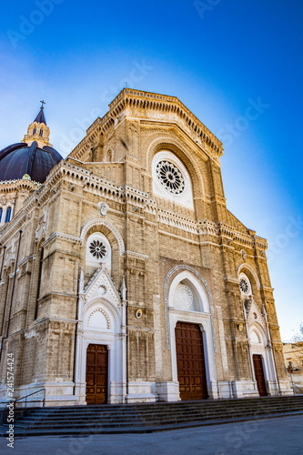 Cathedral of San Pietro Apostolo, also known as Duomo Tonti, by Paolo Tonti, who donated his wealth for its construction. Facade with rose windows, portals and dome. Cerignola, Puglia, Italy.