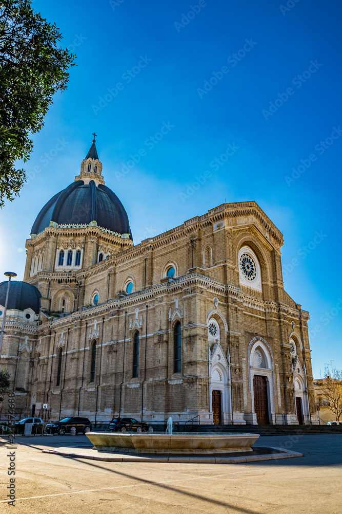 Cathedral of San Pietro Apostolo, also known as Duomo Tonti, by Paolo Tonti, who donated his wealth for its construction. Facade, rose windows, portals, dome and fountain. Cerignola, Puglia, Italy.