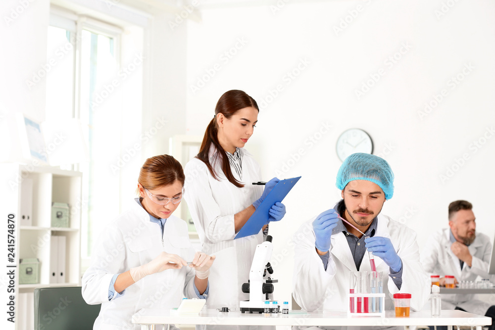 Scientists working in laboratory. Research and analysis Scientists working in laboratory. Research and analysis