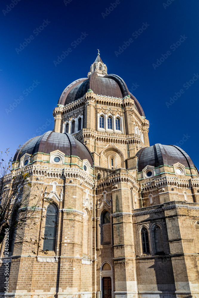 Cathedral of San Pietro Apostolo, also known as Duomo Tonti, by Paolo Tonti, who donated his wealth for its construction. Exterior of the dome and the apses. Cerignola, Puglia, Italy. Cathedral of San Pietro Apostolo, also known as Duomo Tonti, by Paolo Tonti, who donated his wealth for its construction. Exterior of the dome and the apses. Cerignola, Puglia, Italy.