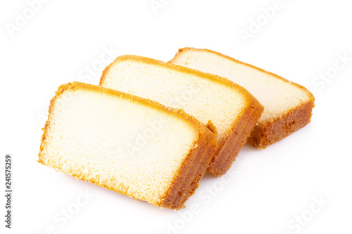 Photo Sliced moist butter cake isolated on white background.