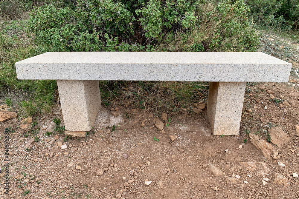 Stone bench covered with marble chips in the park