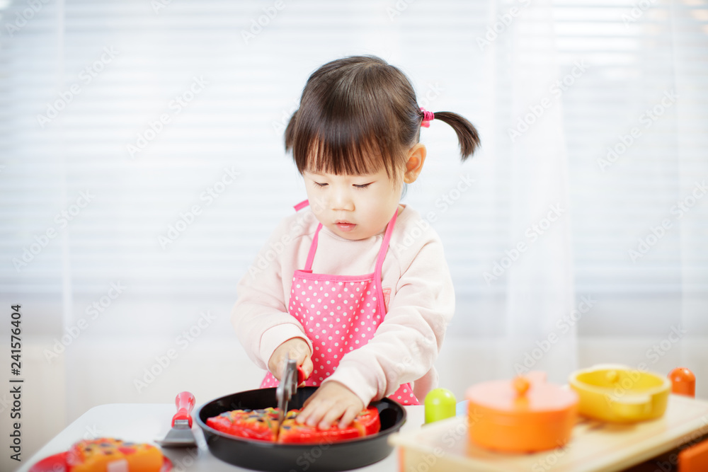 toddler baby girl pretend play food preparing
