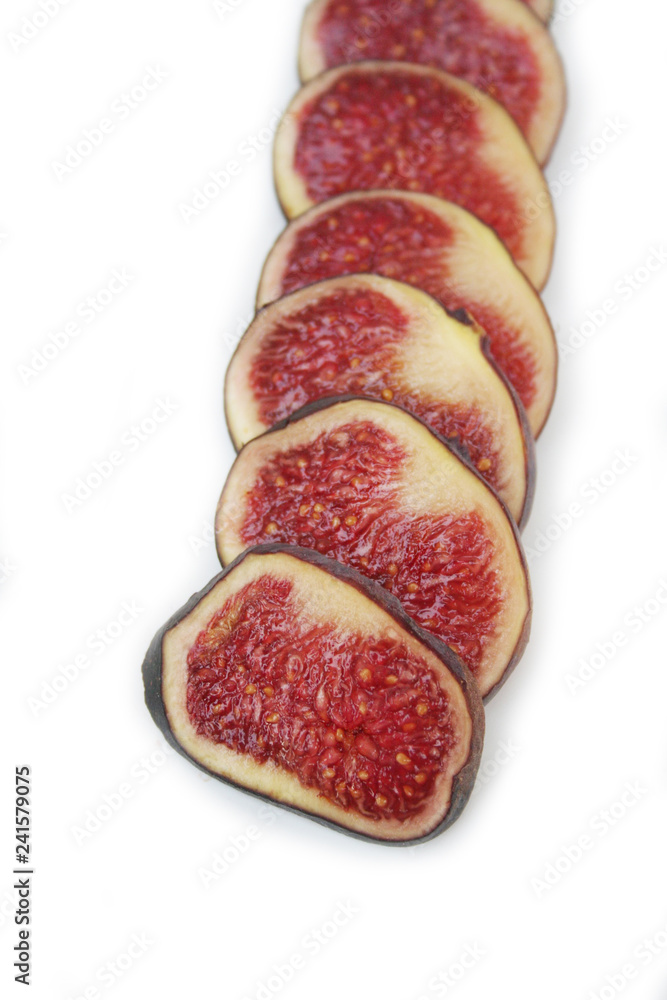 Fresh ripe fig slices in a row isolated on white background
Fresh ripe fig slices in a row isolated on white background
