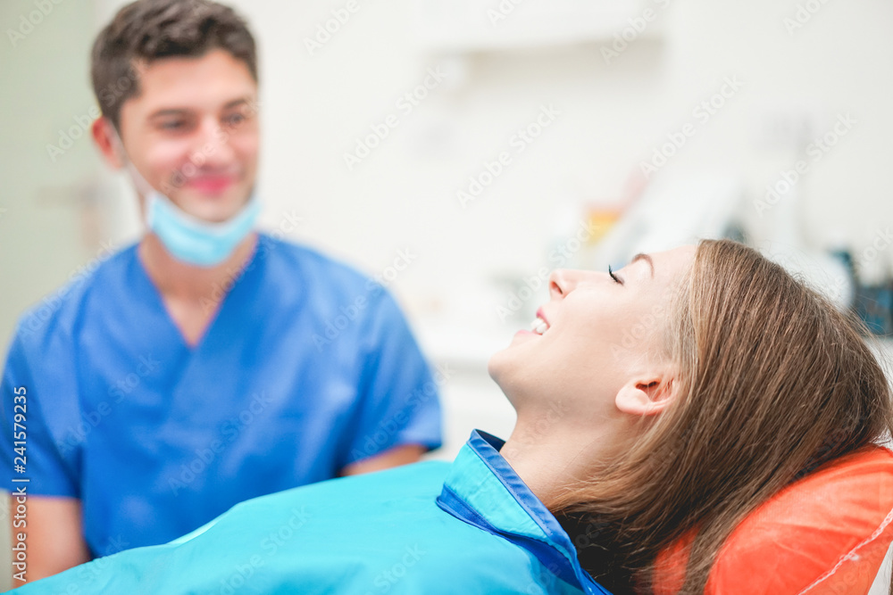 Young woman doing a x-ray for dental treatment inside professional dentist studio Young woman doing a x-ray for dental treatment inside professional dentist studio