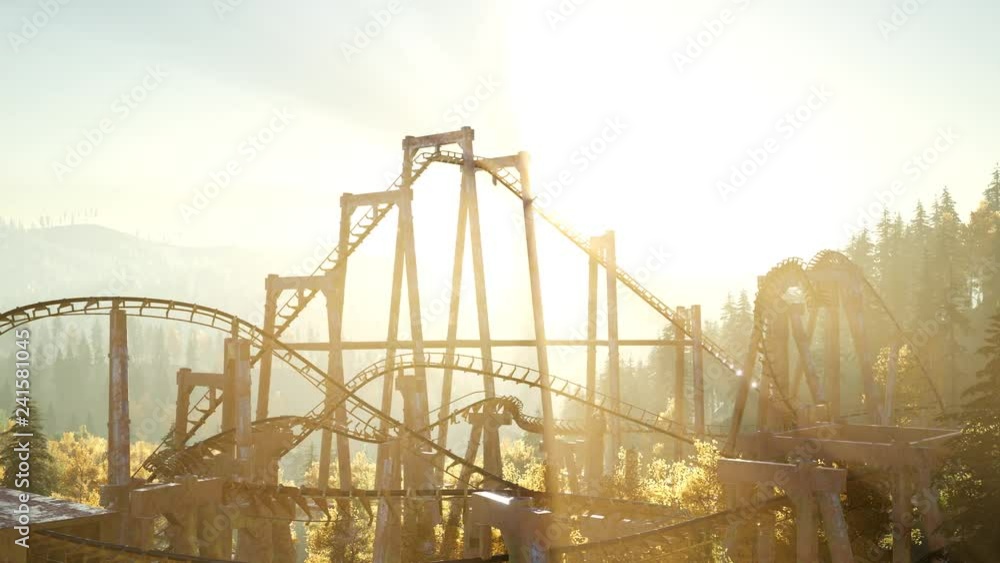 old roller coaster at sunset in forest old roller coaster at sunset in forest
