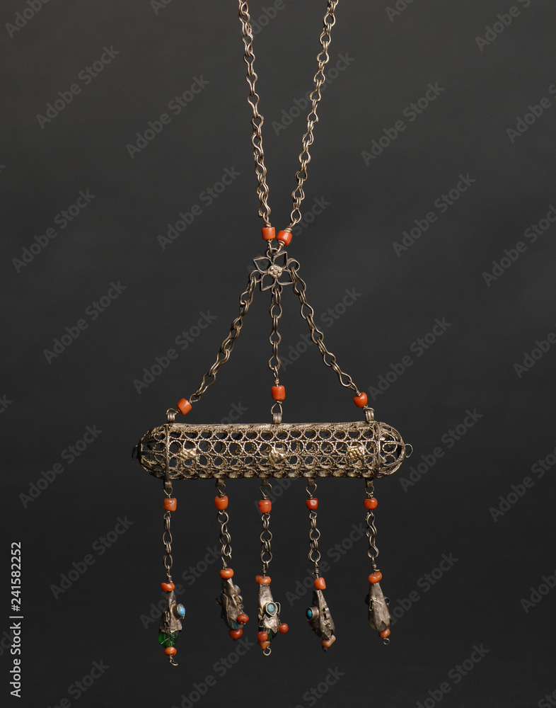 ancient antique pendant with stones on black background. Middle-Asian vintage jewelry ancient antique pendant with stones on black background. Middle-Asian vintage jewelry