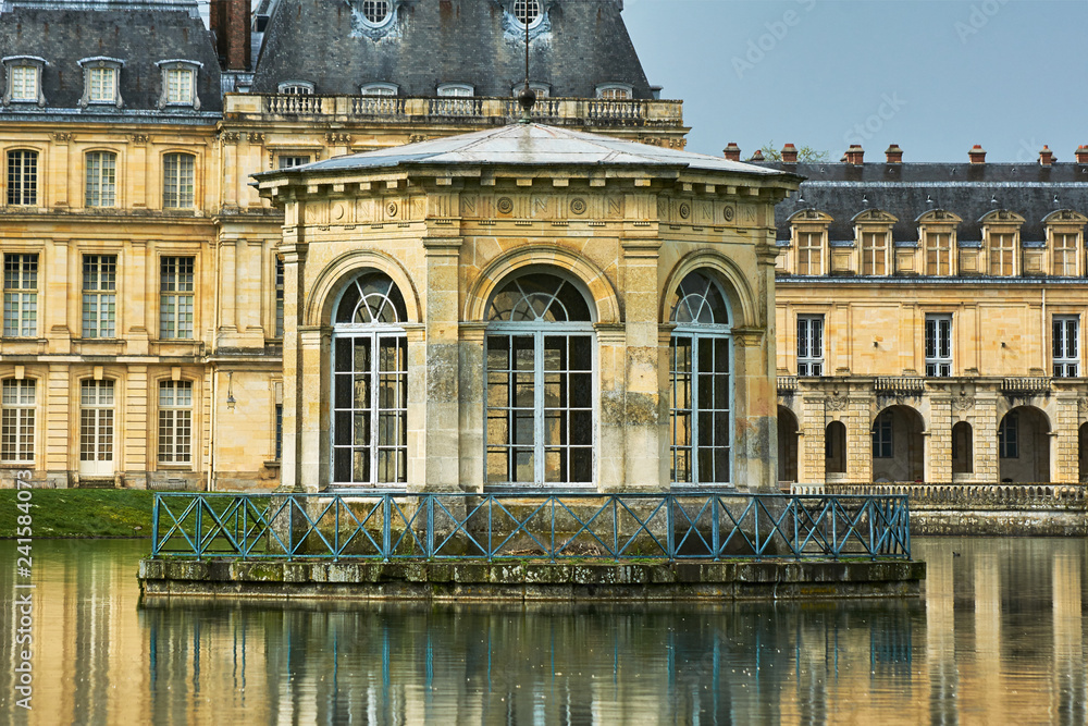 pond and the palace of Fontainebleau in France..
