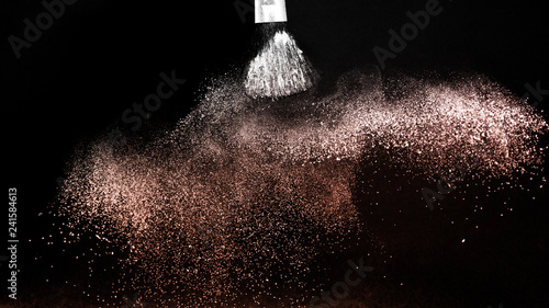 Living Coral Color of the year 2019, powder splash and brush for makeup artist or beauty blogger in black background