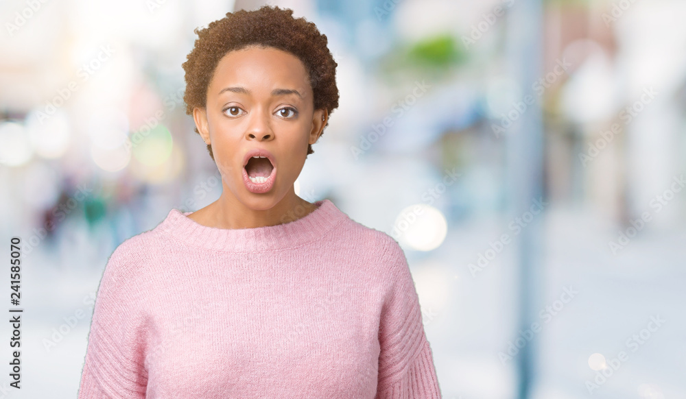 Beautiful young african american woman over isolated background afraid and shocked with surprise expression, fear and excited face. Beautiful young african american woman over isolated background afraid and shocked with surprise expression, fear and excited face.